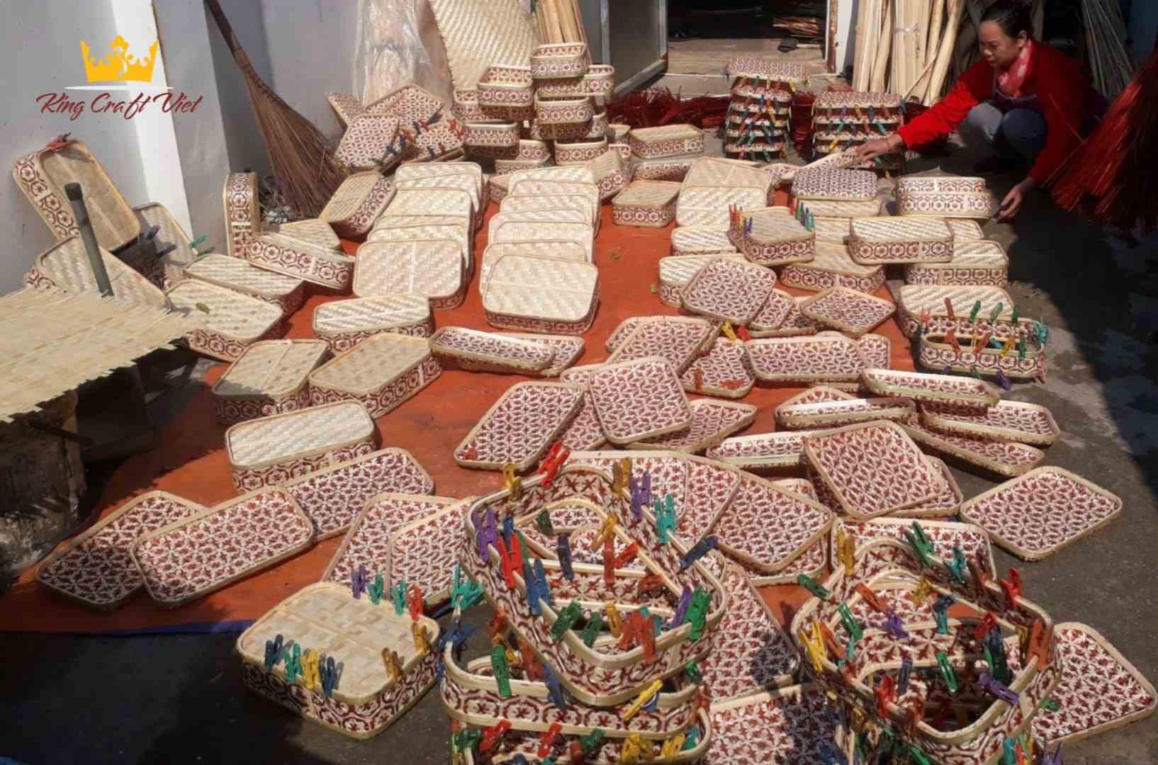 Vietnamese artisans weaving rattan furniture at King Craft Viet factory